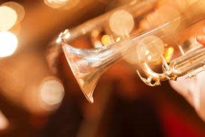 Detail of the trumpet closeup in golden tones