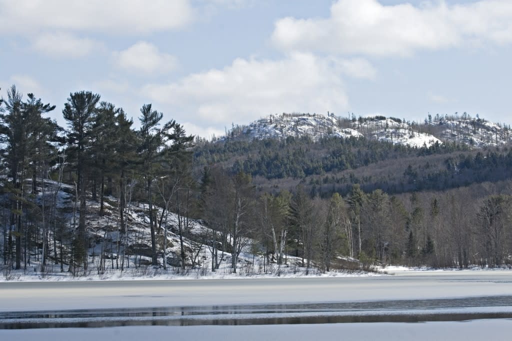 Frozen Harlow Lake and Hogback Mountain in the Escanaba River State Forest near Marquette Michigan Upper Peninsula.