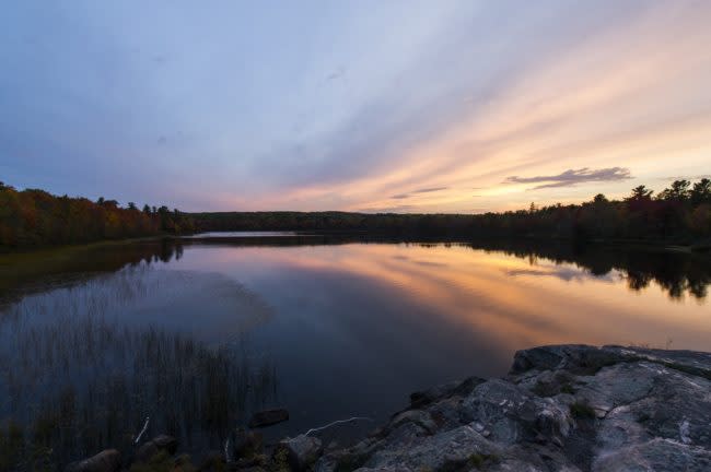 Dusk over Harlow Lake in autumn fall color near Marquette, Michigan on Michigan's Upper Peninsula.