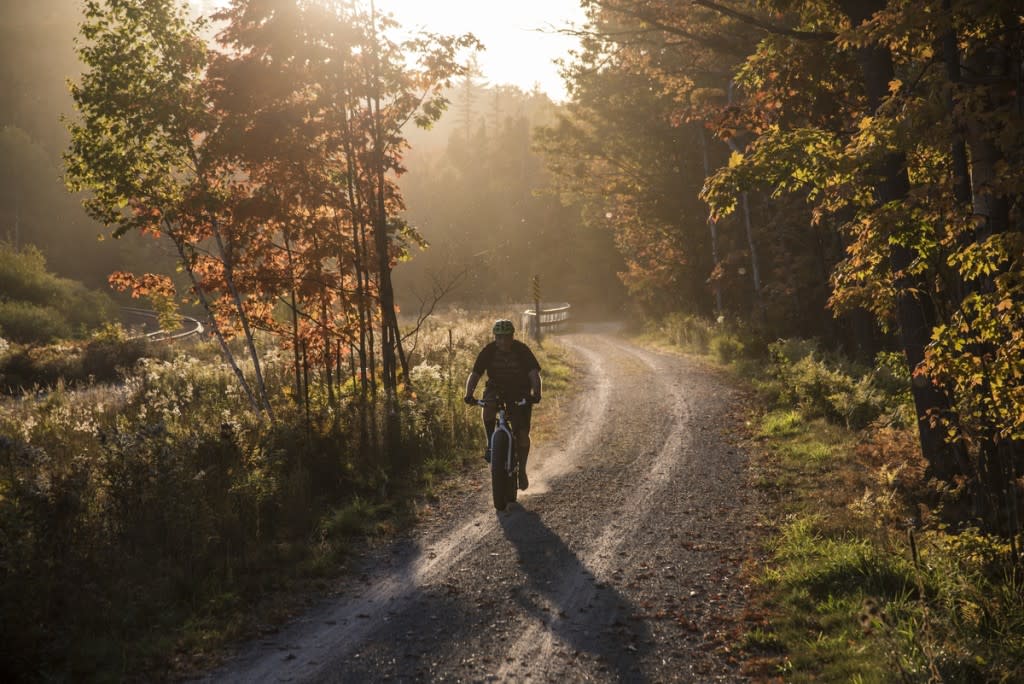 A mountain biker on the Iron Ore Heritage Trail that connects communities in Marquette County, Michigan.