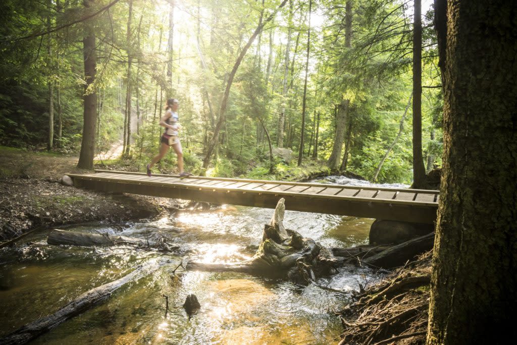 Runners participate in the half-marathon trail run event during Marquette Trails Fest.