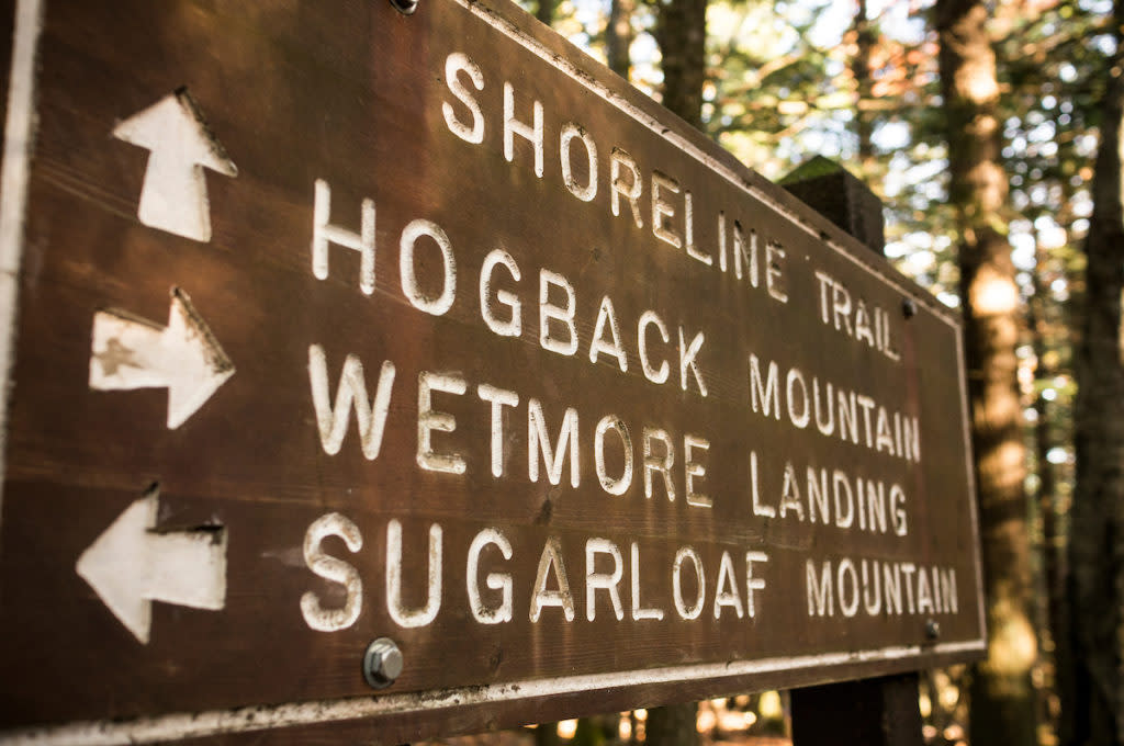 Trail sign for Hogback Mountain, Wetmore Landing and Sugarloaf Mountain along the Shoreline Trail and North Country Trail near Marquette, Michigan.