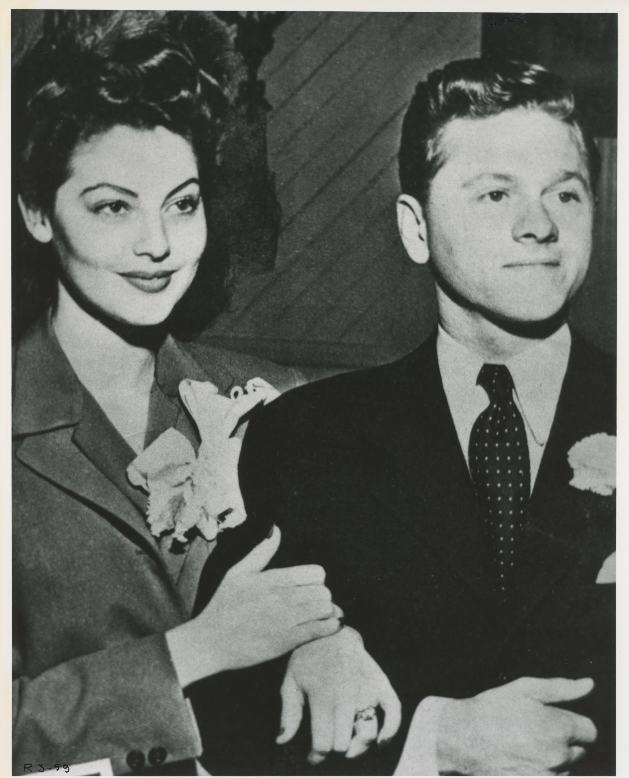 Ava and Mickey's Wedding; Newlyweds clutching each other