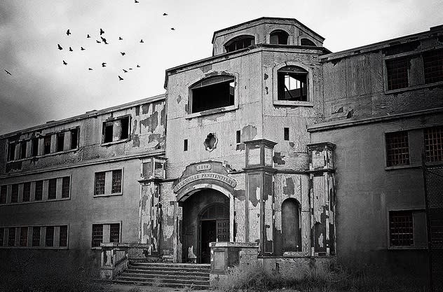 The exterior of Old Main at the New Mexico State Penitentiary evokes a spooky feel.