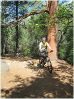 Another giddy cyclist pedaling Santa Fe’s righteous trails. (Photo courtesy of Andrew Yates Photography)