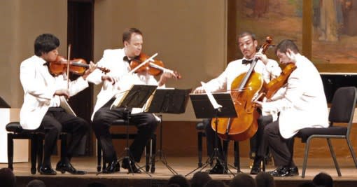 The Miro Quartet strums on stage at the St. Francis auditorium. (Photo: New York Times)