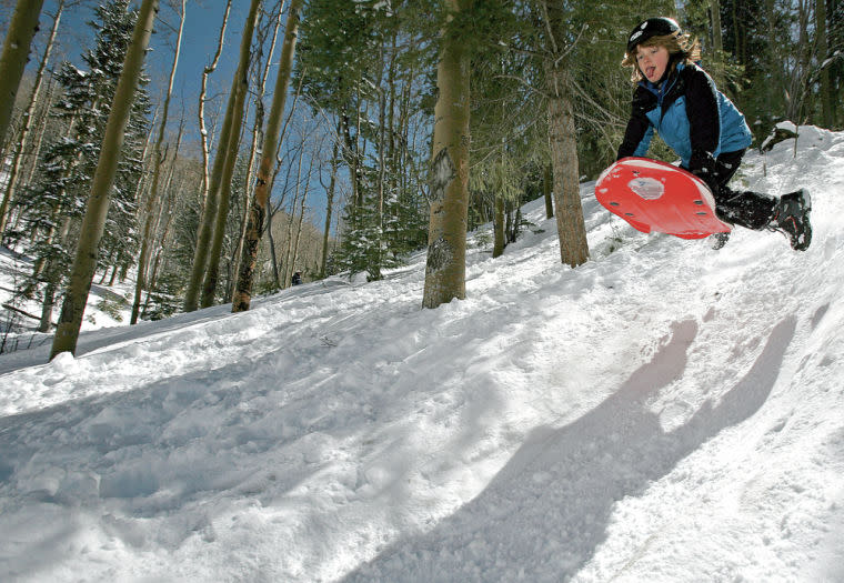 With the Sangre de Cristo Mountains in our backyard, Santa Fe is the perfect base for sledding adventures. (Photo courtesy of The Santa Fe New Mexican)