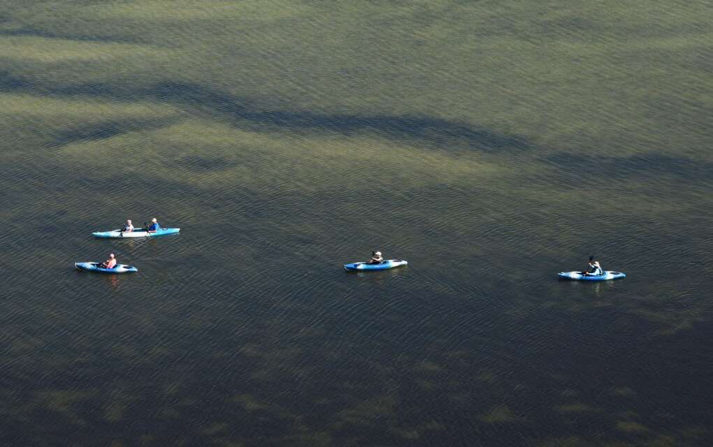 Kayakers in a huge expanse of water on the Great Calusa Paddling Trail