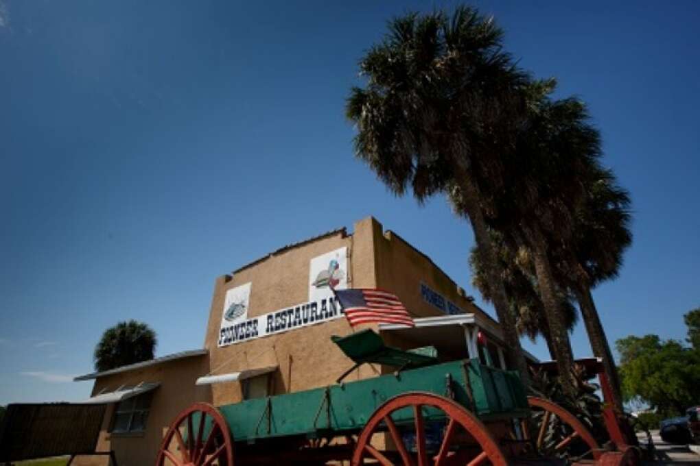 Palm Trees and wagons sit next to the Pioneer Restaurant in Zolfo Springs, Florida on March 2, 2015. VISIT FLORIDA/Scott Audette