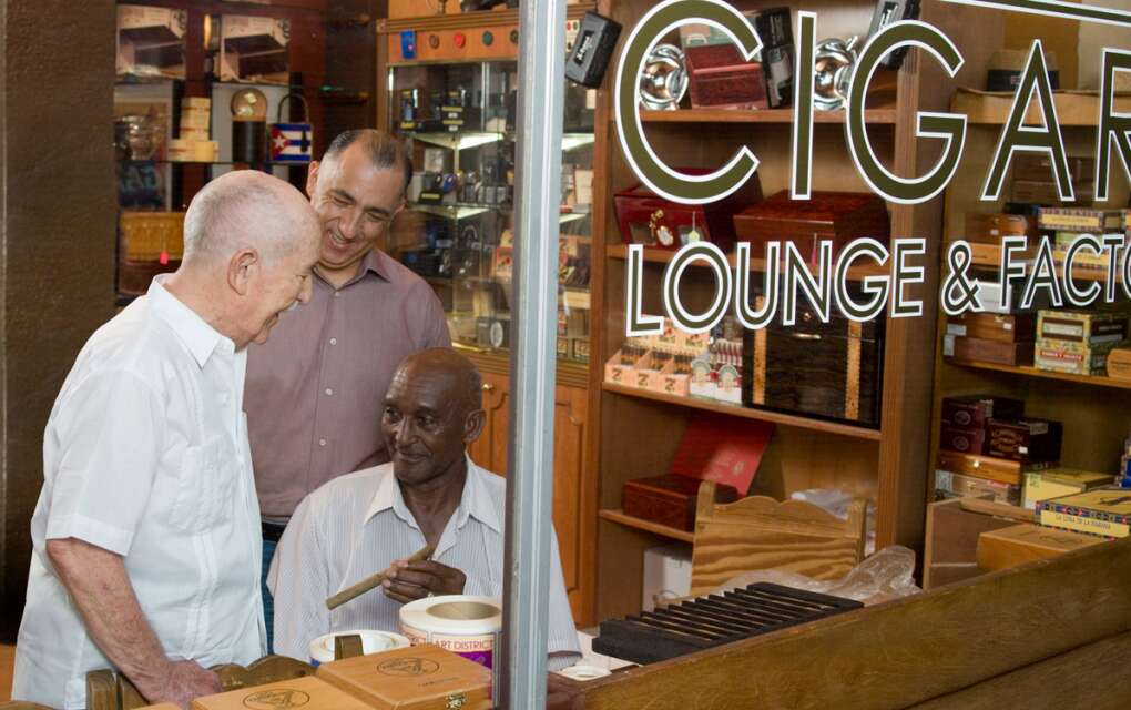three happy men at cigar shop in Calle Ocho