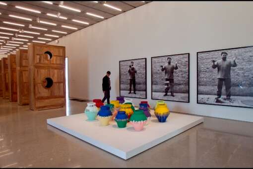 A museum patron walks through the ‘Ai Weiwei: According to What?’ exhibit at the Perez Art Museum Miami. In February, a Dominican-born artist smashed one of the 16 ‘Colored Vases’ in the exhibit, purportedly to protest what he perceived as the museum’s bias in favor of international artists over local artists. He later apologized publicly to Ai Weiwei and to his fellow Miami artists.
