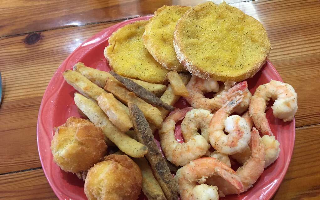 At Lightsey's discover home-cooking like this plate of fried shrimp, hush puppies, fried green tomatoes, and french fries.
