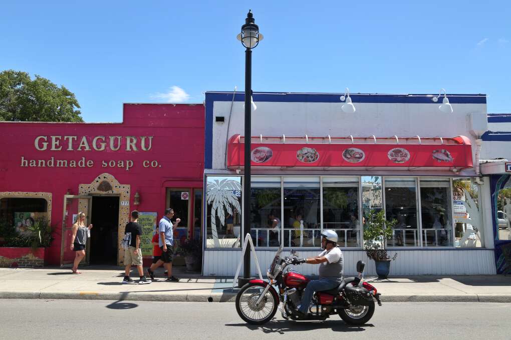Businesses that cater to visitors line Dodecanese Boulevard in Tarpon Springs including Getaguru Handmade Soap Company and Hellas Greek Restaurant.  