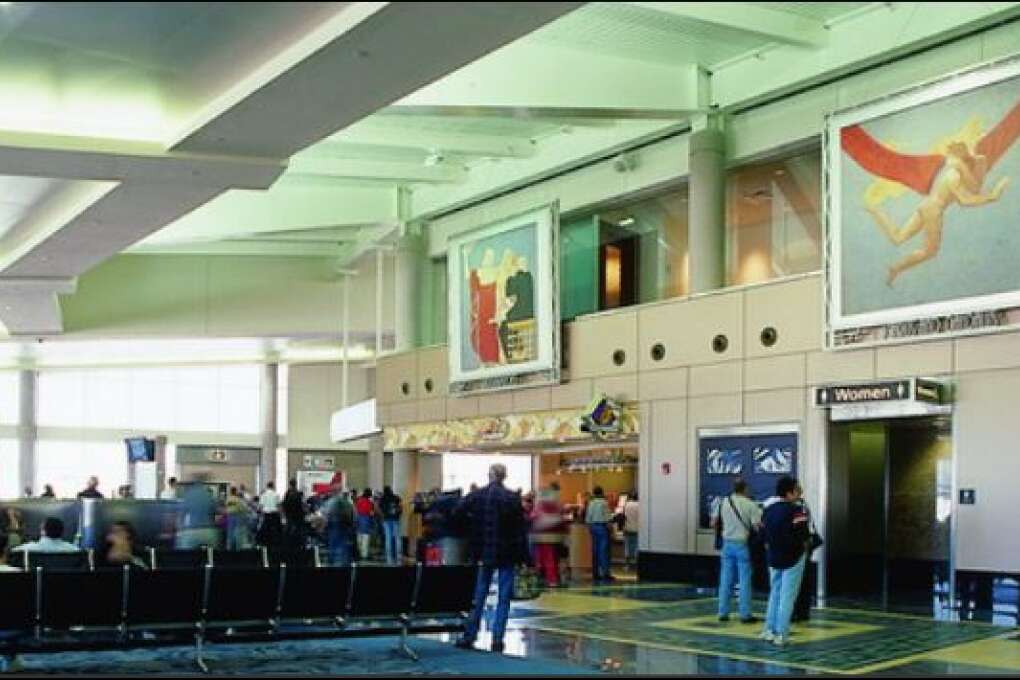 “The Art of Flight” WPA murals by George Snow Hill at Tampa International Airport depict the history of flight. 