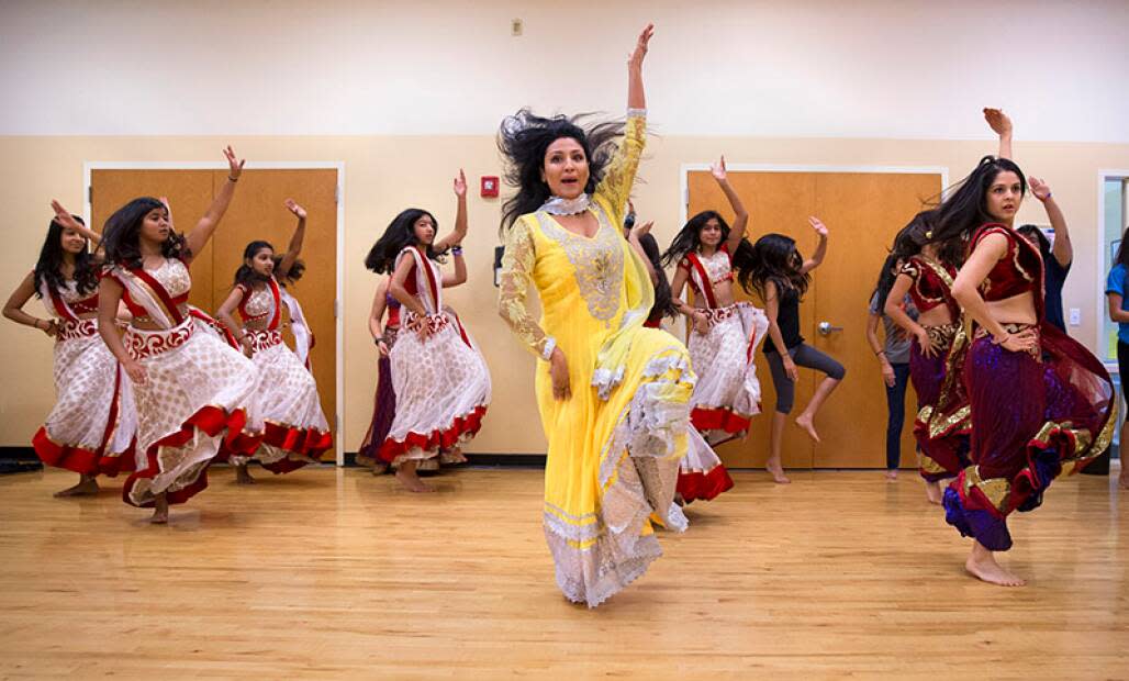 Chandni, owner of C. Studios Inc., leads her students during dance rehearsal at the Jewish Community Center in Orlando where the classes blend Indian cultural dance with modern movements.  