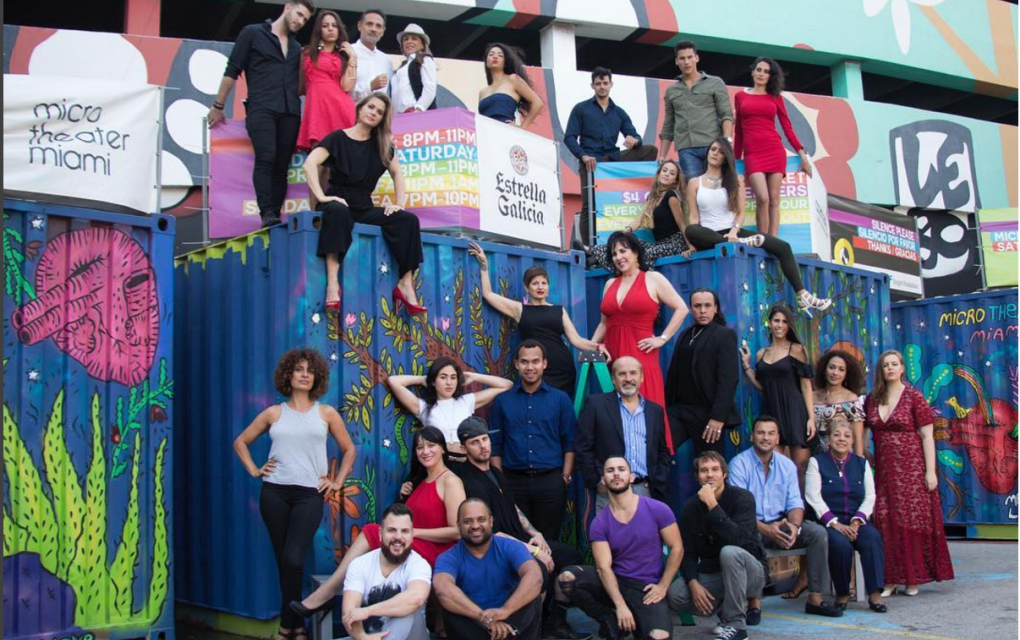 Microtheatre Miami cast posing on shipping containers