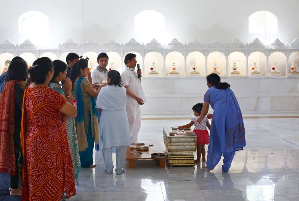 Families gather at the Jain Temple in Tampa for a Sunday morning prayer service. 