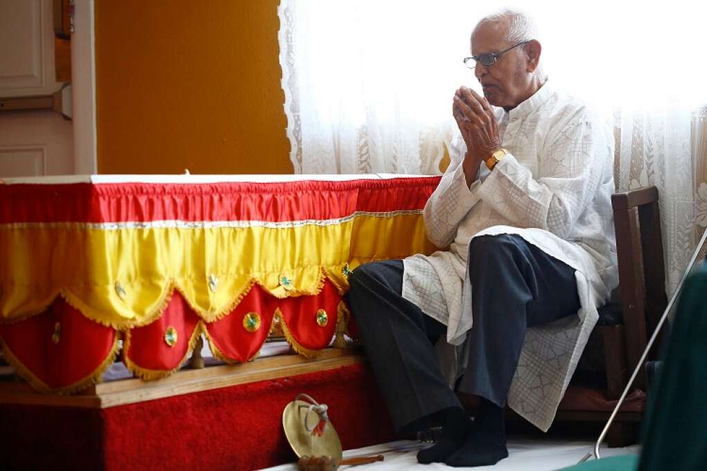 Gocool Sayroo prays during a Sunday morning prayer service at the Vishnu Mandir in Tampa.
