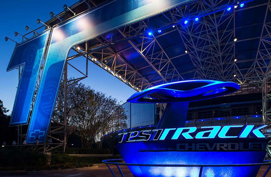 Test Track Presented by Chevrolet structure with blue lights at Epcot in Orlando.