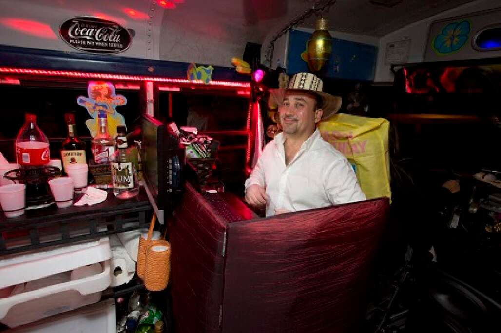 A man by the bar on board of La Chiva Party Bus