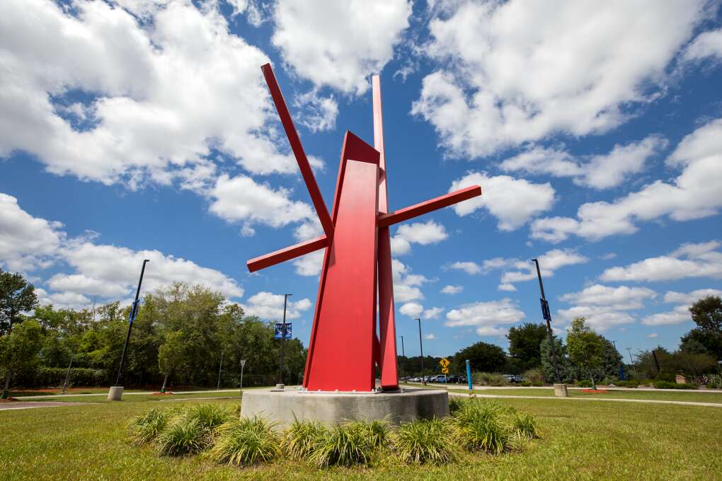 The University of North Florida boasts a large collection of more than 20 outdoor sculptures. One of the largest is John Henry’s “Axiom,” a 35-foot high and 20-foot wide sculpture that weighs 18 tons and is made of steel and painted in safety red enamel. 