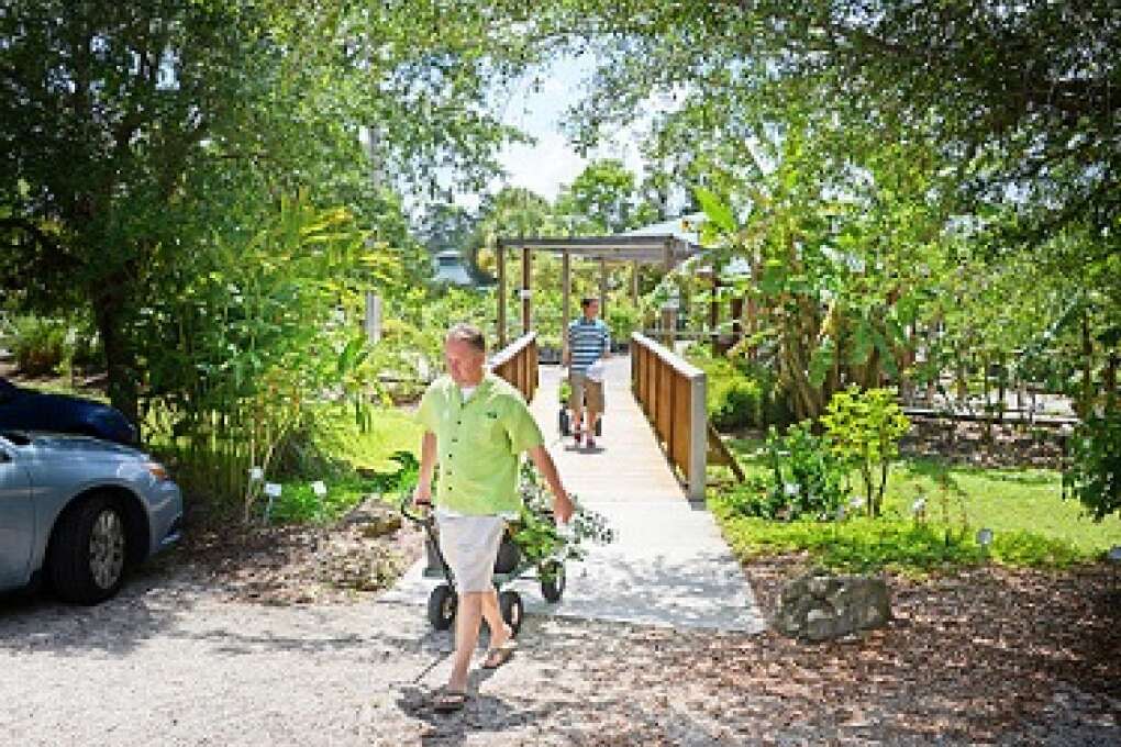Cliff Sheehan leaves the nursery of ECHO Global Farm with plants to start his own garden. The nursery specializes in a diverse selection of tropical and sub-tropical fruits, edible plants and tropical clumping bamboo particularly well-adapted for planting in southwest Florida.