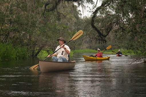 Paddlers move along the six miles of the Ichetucknee River, the same place Franciscan priests baptized Timucua Indians.