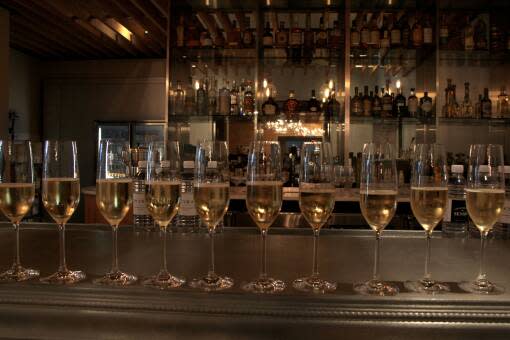 Glasses of bubbly are lined up at The Bar at Elevage in Tampa’s Epicurean Hotel. 