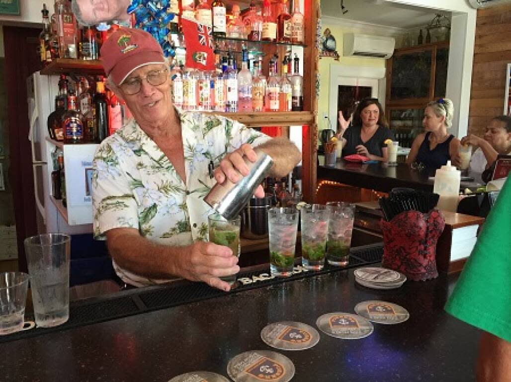 Bob Leonard making cocktails at the bar table at The Rum Bar