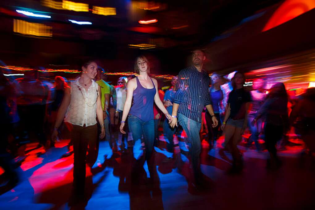 The legendary line dancing is underway at the Dallas Bull in Tampa, a 34,000-square-foot, no-frills nightclub.