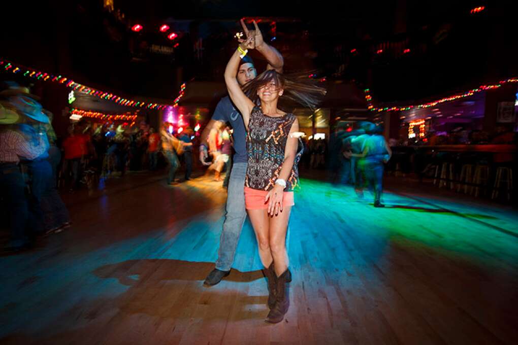 A couple dances the two-step at the Dallas Bull, a 34,000-square-foot, no-frills club in Tampa.