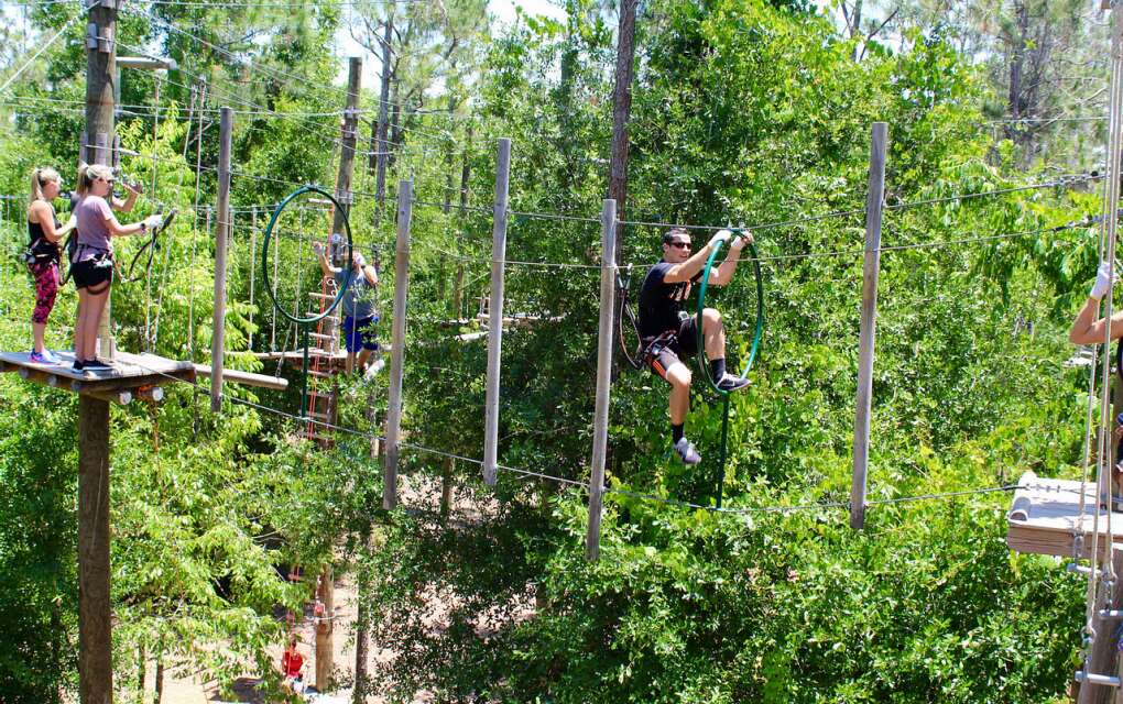 Glide through the treetops, navigate through 97 aerial challenges, and experience a 425-foot zip line at Orlando Tree Trek Adventure Park in Kissimmee.