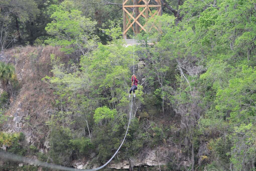 The 100-foot lines of the Canyons Zip Line tour in Ocala span sparkling water and wild habitats of swooping hawks and kingfishers.