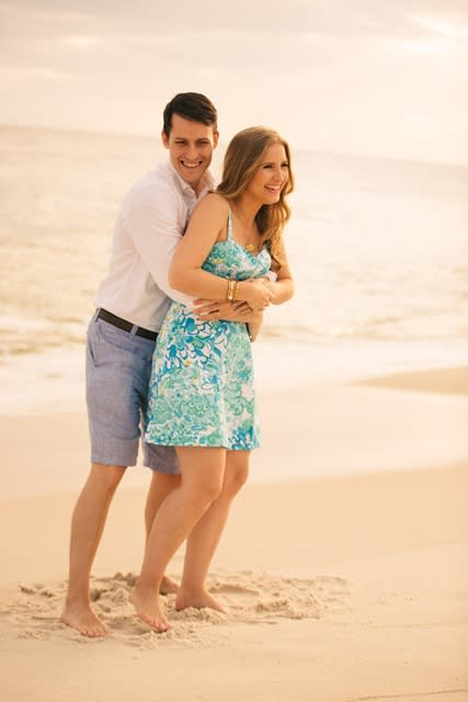 A couple hugging at the beach