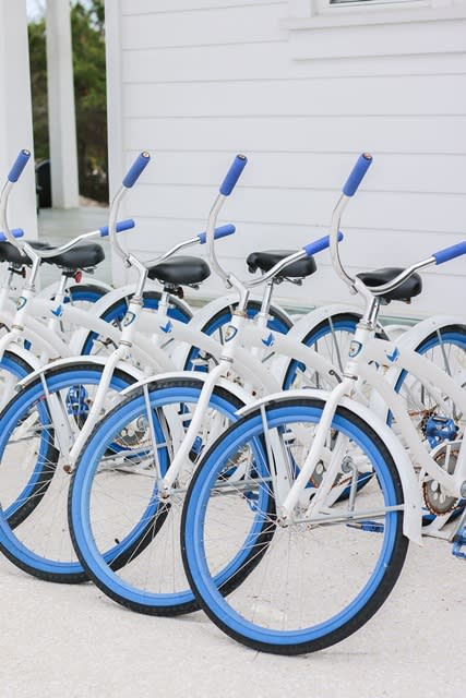 Blue and white rental bikes from the Bike Shop Alys Beach