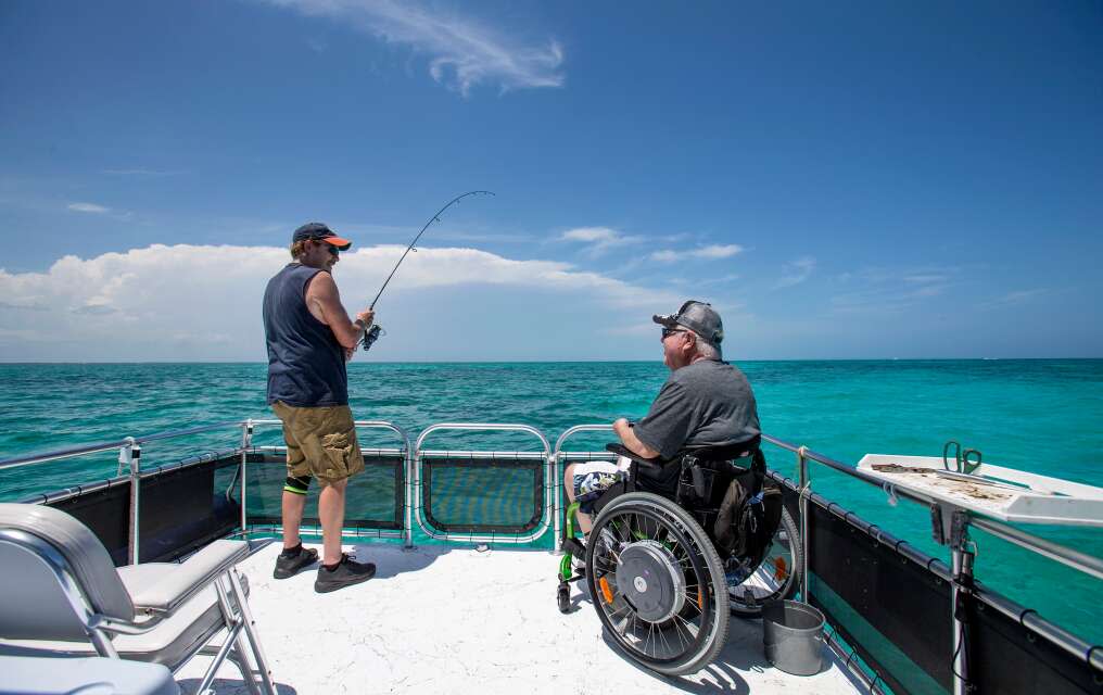 Steven Schindler (right) and Gary Matoney of Pittsburgh, enjoy a successful day of fishing in the ocean off of Key Largo aboard Michael  