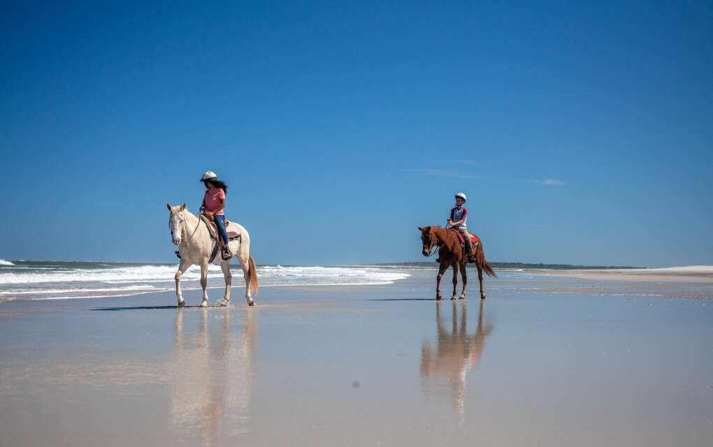 Horseback riders on Amelia Island beaches, which are wide and regularly flattened by the Atlantic Ocean that they look like a freshly scrubbed floor.