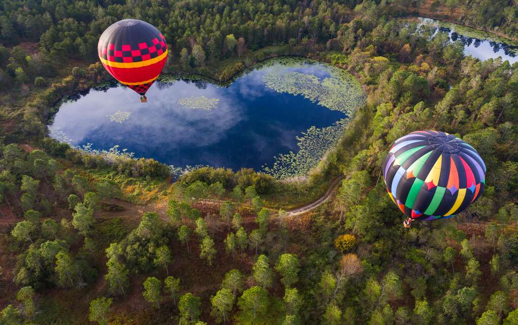 arial view of balloons over heart-shaped lake in Orlando