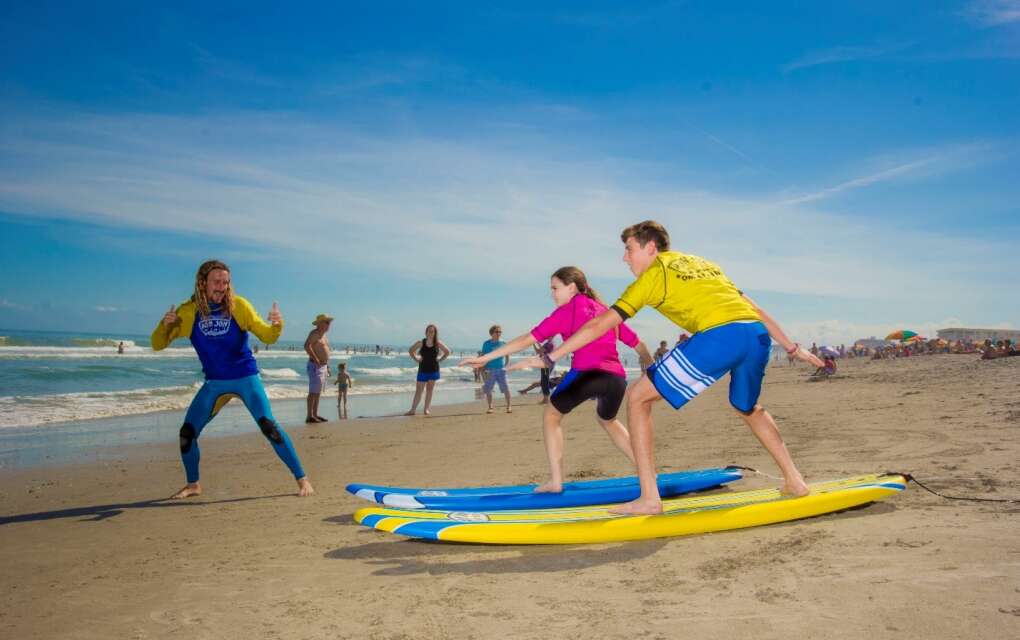 Enjoy surf lessons from locations along the Space Coast's 72 miles of shimmering beaches, including Ron Jon Surf School.