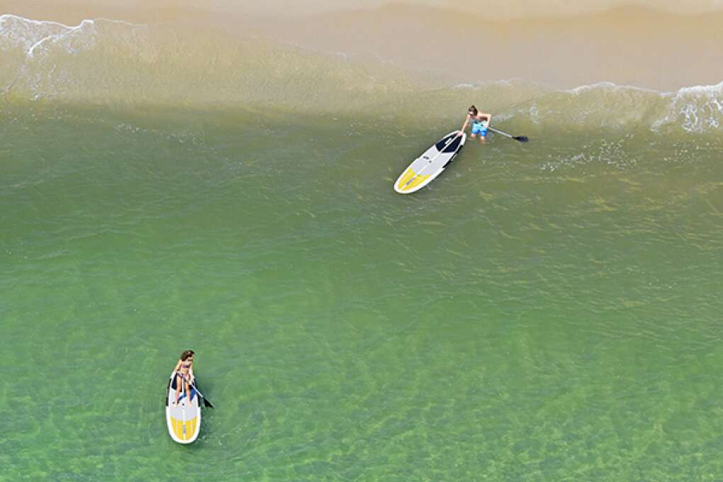 Paddle boarders head out on the Atlantic Ocean just yards from Broward County A1A Scenic Highway in Fort Lauderdale. 