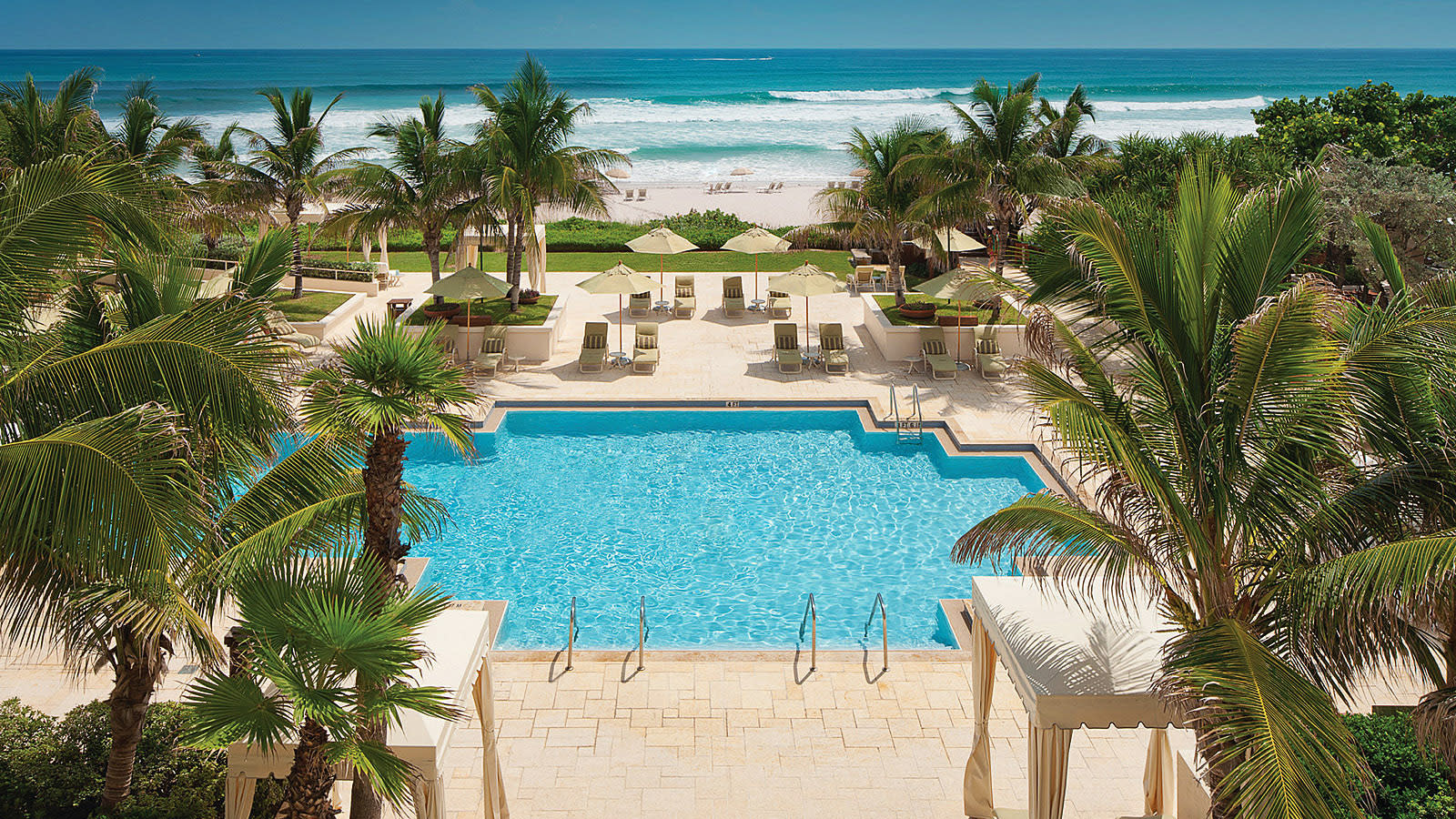 An aerial view of the pool area by the beach