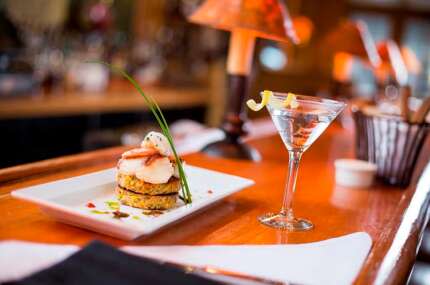 At Jackson’s Steakhouse in Pensacola, Chef Irv Miller’s Southern-influenced cuisine features the emblematic foods of ‘real Florida,’ like these shrimp-topped crabcakes.