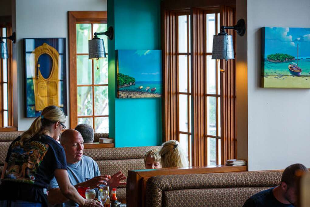 Paintings and color scheme set the tone for the beachy vibe at Lost Lagoon Wings & Grill in New Smyrna Beach.
