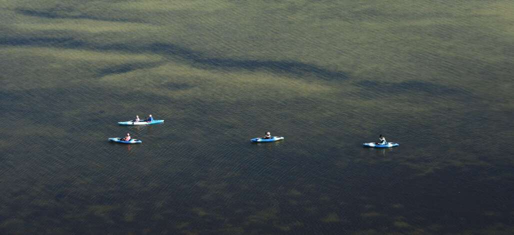 Kayakers in a huge expanse of water on the Great Calusa Paddling Trail