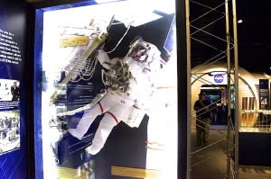 An astronaut floats high above the ISS