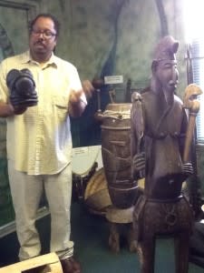 Dr. Aden discusses the lives of Africans using scultpures in the museum.