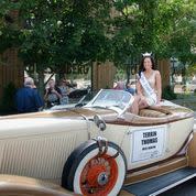 silver car with beauty queen