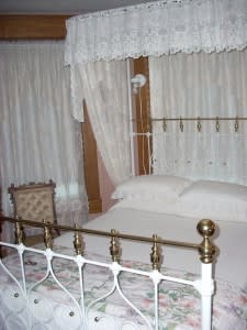 Canopy bed at Schug House Inn offers look and feel for the past in quiet comfort.