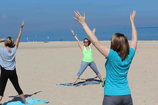 Clear skies and views of nothing but sand and crystal clear water. That's yoga at Indiana Dunes State Park along Lake Michigan.