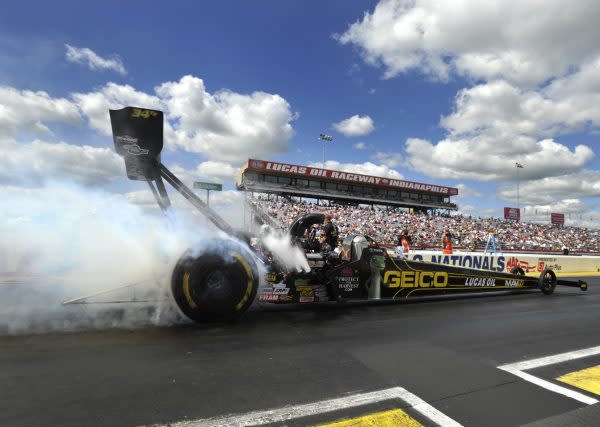 Top Fuel dragster burns out at the start line.